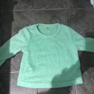 A green cozy sweater